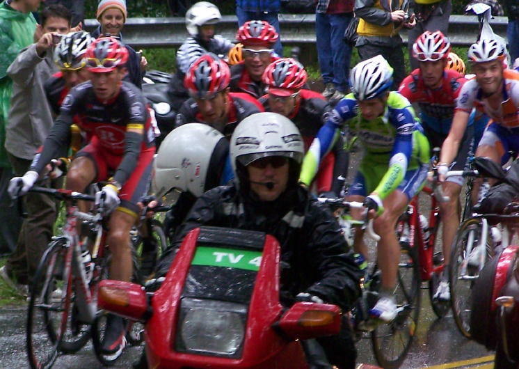 Team Radio Shack and Lance Armstrong far left behind the motorcycle going up the climb