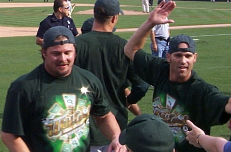Players return to the field to greet the many fans including 2000 American League MVP Jason Giambi