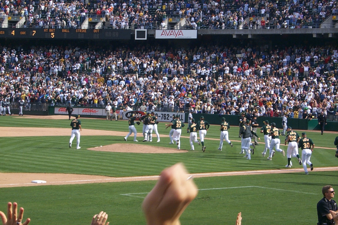 Players run onto the field for the pitcher's mound.
