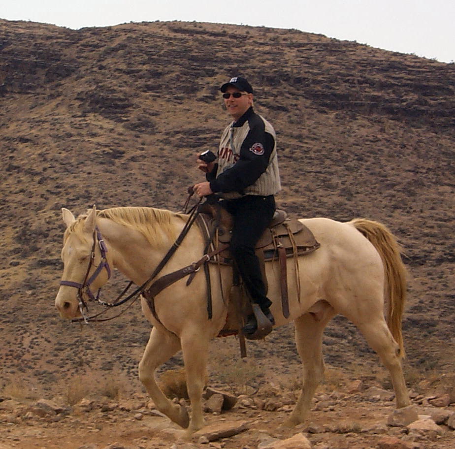 Dennis on his horse named Dusty.