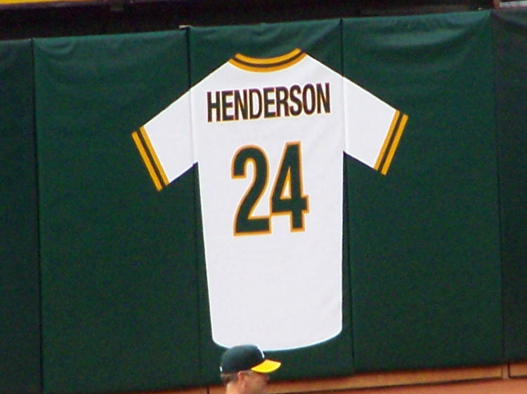 Henderson Jersey uncovered on the left field fence