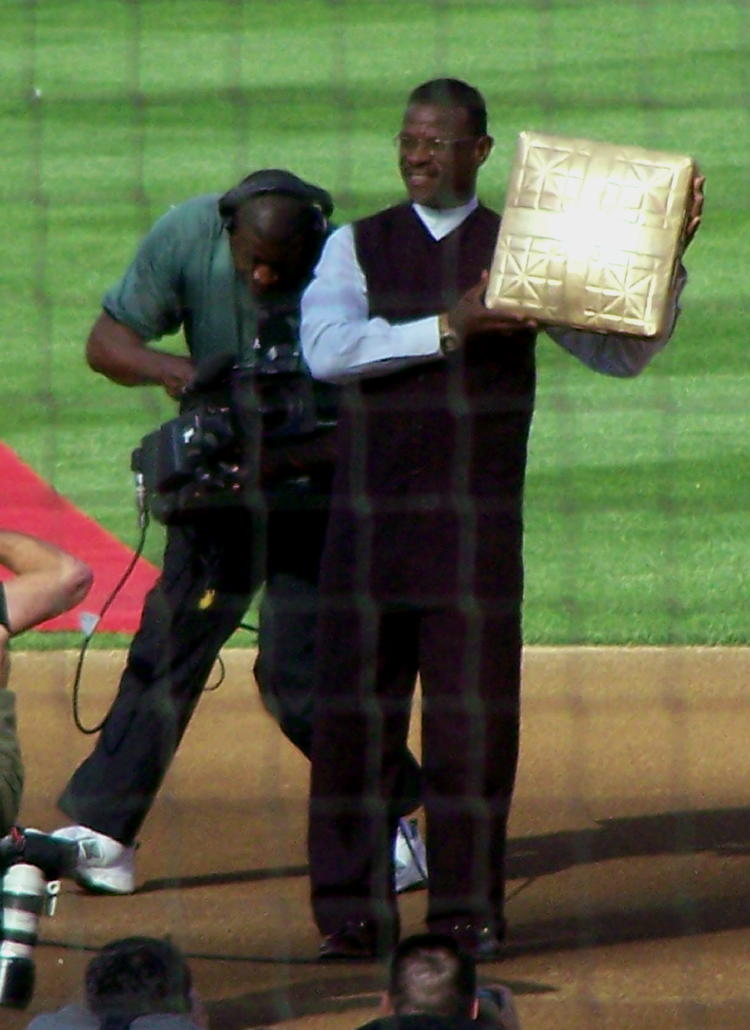 Ricky lifts the gold second base bag 