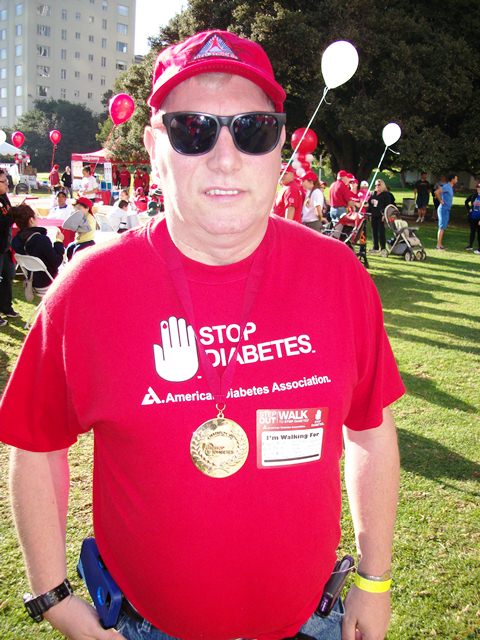 Dennis with his Champions Medal for raising over $1,000.