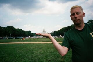 Dennis holds the Capital building in his hands - gee, such power
