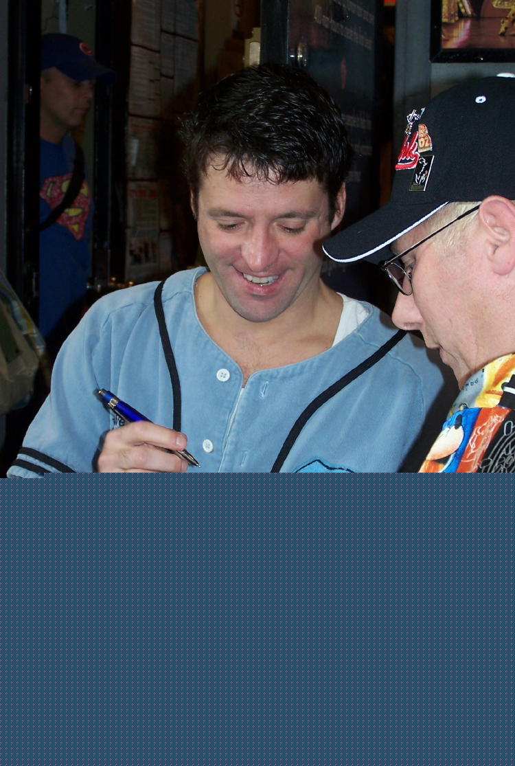 Dennis obtains an autograph from Aldrin Gonzalez who played the role of Bookseller