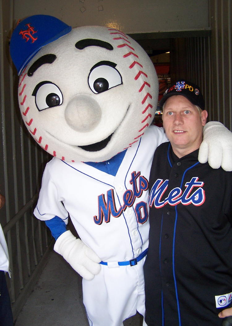 Dennis meets his pal Mr. Met.  He spoke often before our trip to New York that he wanted to meet Mr. Met.  Mr. Met even made a point of coming to our seats just to meet Dennis.