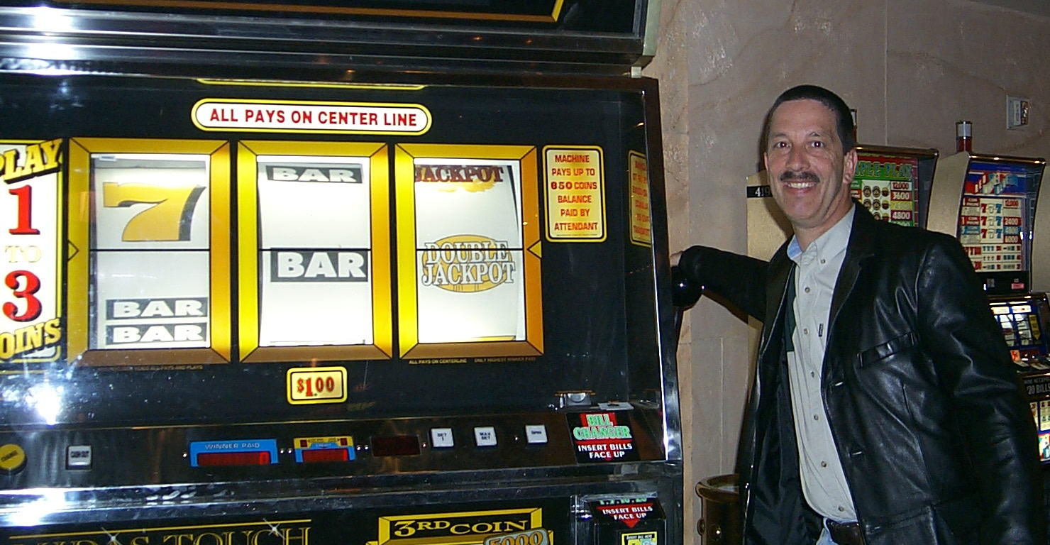 Dave's smiles yet knows he's another sucker playing this slot machine.