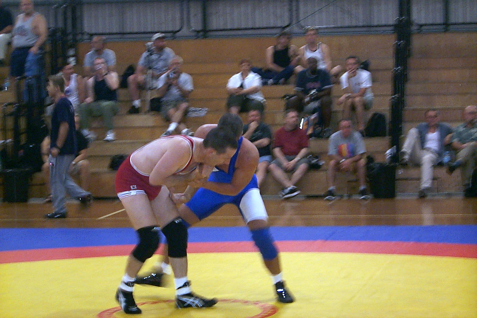 Dave trying to grab an arm wrestling on the same mats used at the 2000 Olympics.